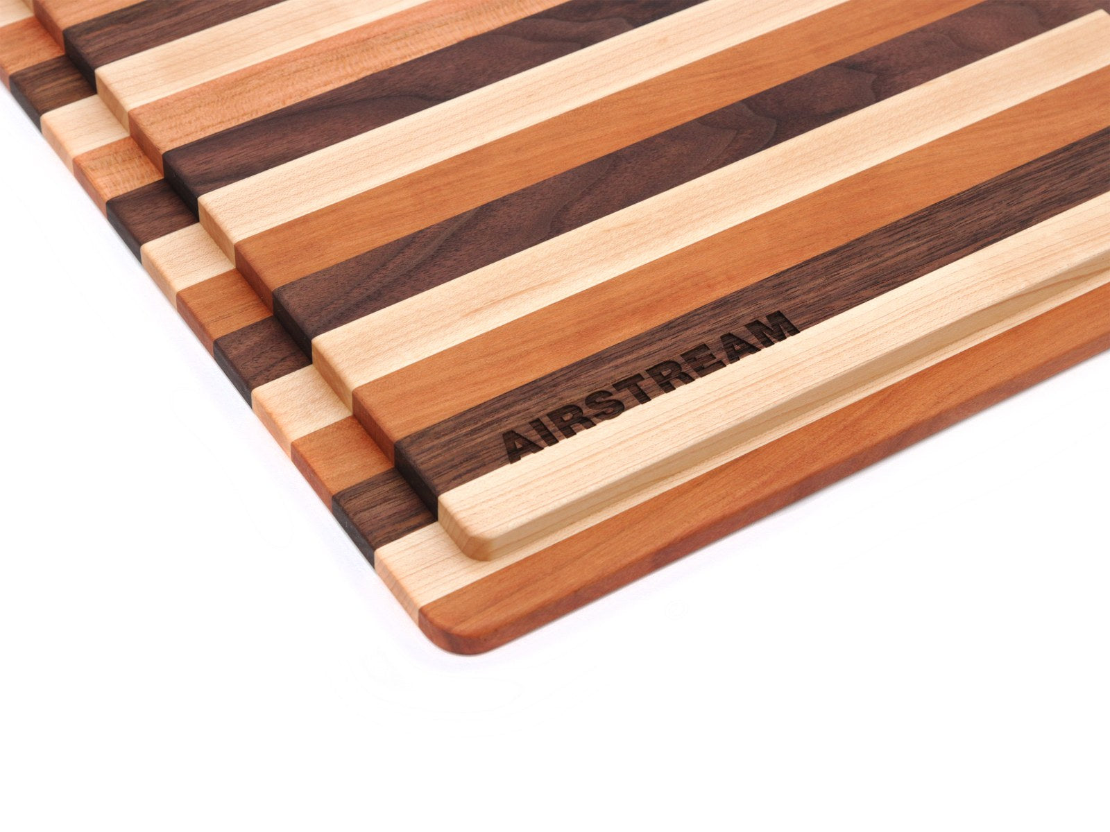 Close-up of Airstream sink covers with contrasting light, medium, and dark wood strips