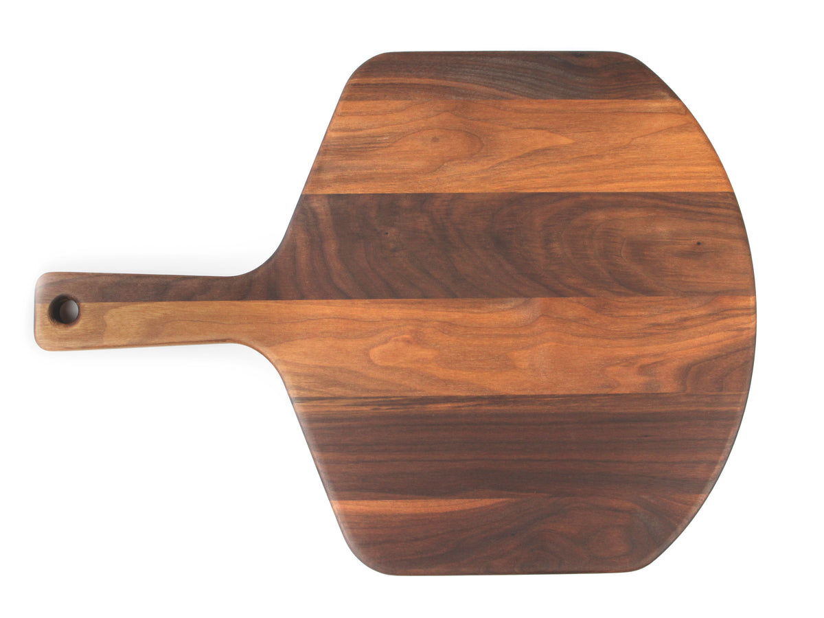 Walnut pizza peel viewed from above, showing its outline and hanging hole.
