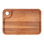 Cherry thumb-hole cutting board with specialty juice groove, top view.