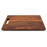Walnut 16 × 10.5 single-handle cutting board, low angle