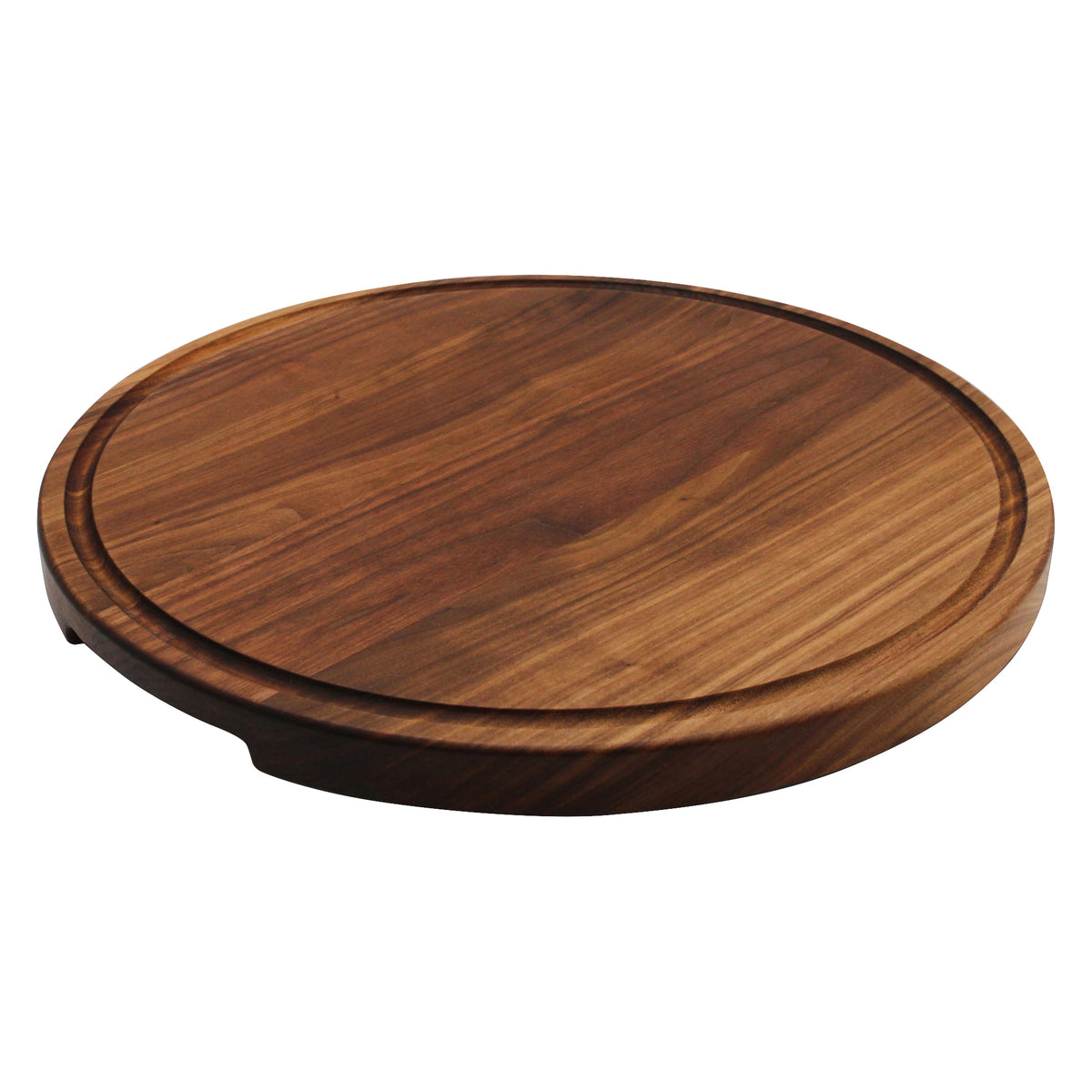Walnut 18-inch thick round cutting board with juice groove, angled top view.