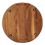 Walnut 18-inch thick round cutting board underside with four black rubber feet, straight-on view.