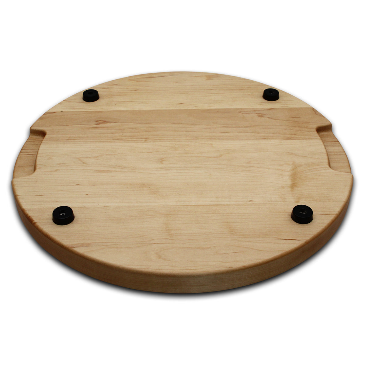 Maple 18-inch thick round cutting board underside with four black rubber feet, angled view.
