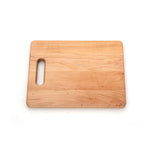 Maple 12 × 9 single-handle cutting board, angled view
