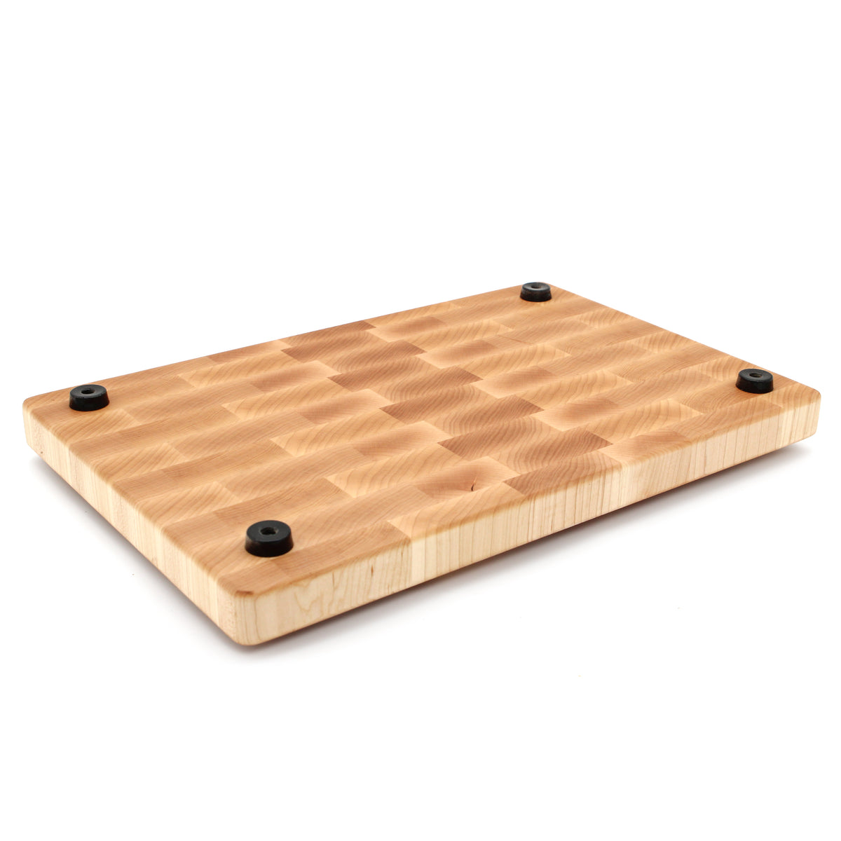 Maple 18 × 12 end-grain cutting board with rubber feet, underside view