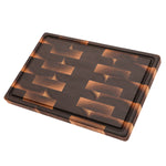 Walnut 18 × 12 end-grain cutting board with juice groove, angled view