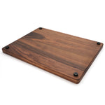 Walnut 24 × 18 thick flat-grain cutting board with feet, underside angle