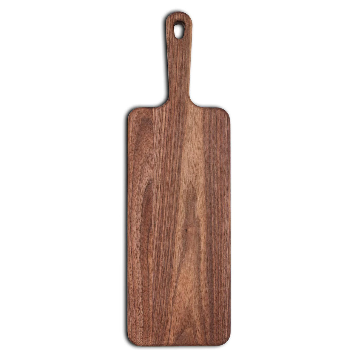Walnut narrow paddle serving board with built-in handle and hanging hole, shown from above on white.