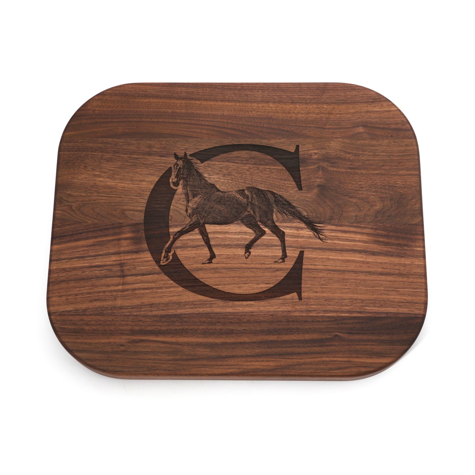 Walnut board engraved with a horse illustration and letter C